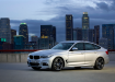 BMW 3 Gran Turismo на фоне большого города