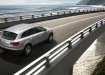 Audi Q7 - официальное фото, в движении по мосту