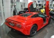 Bugatti EB 110 в красном цвете в шоу-руме автосалона