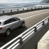Audi Q7 - официальное фото, в движении по мосту