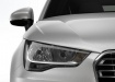 Audi A1 крупным планом - фара и решётка радиатора
