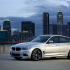 BMW 3 Gran Turismo на фоне большого города